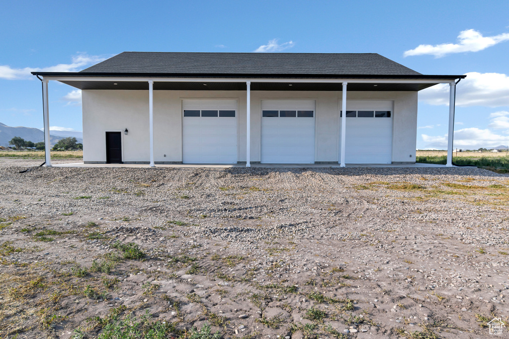 Detached garage with a mountain view