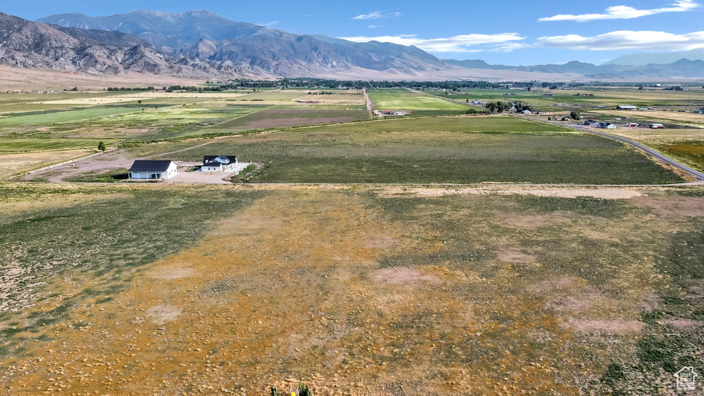 Overview of rural landscape with a mountain backdrop