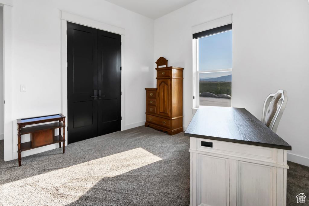 Unfurnished office with carpet floors and a mountain view