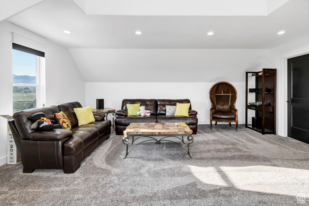 Living room featuring carpet floors, recessed lighting, and vaulted ceiling