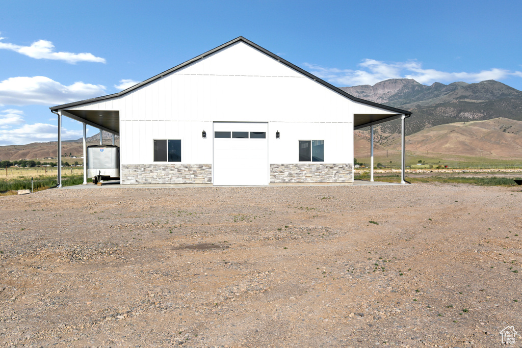 View of outbuilding featuring a mountain view