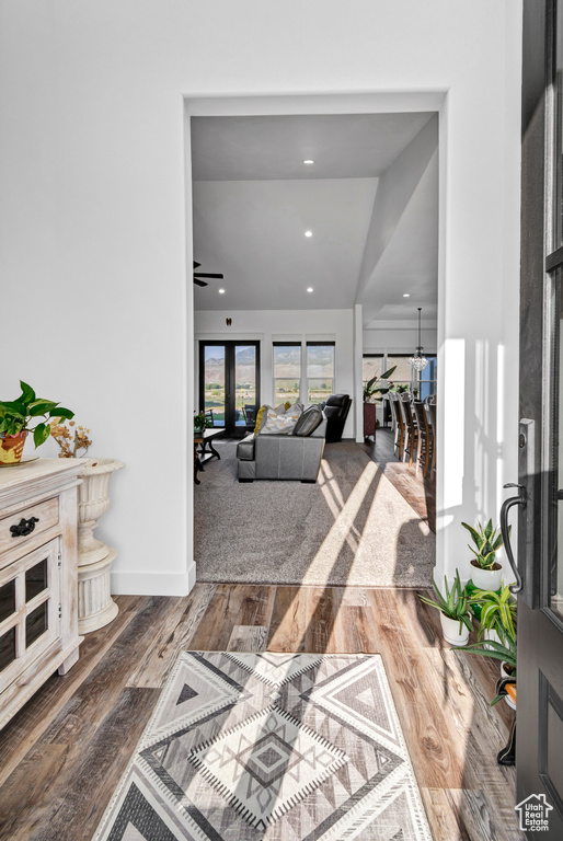 Hall featuring wood finished floors and recessed lighting