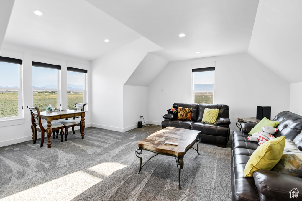 Living room featuring vaulted ceiling, healthy amount of natural light, carpet, and recessed lighting
