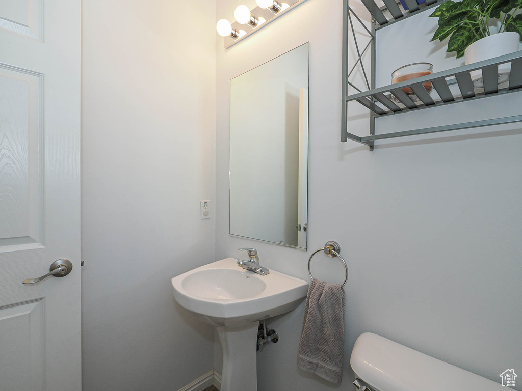 Half bath featuring toilet