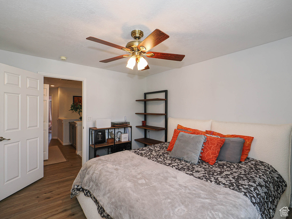 Bedroom featuring wood finished floors and a ceiling fan