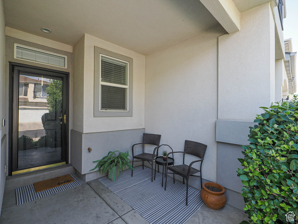 Property entrance featuring stucco siding
