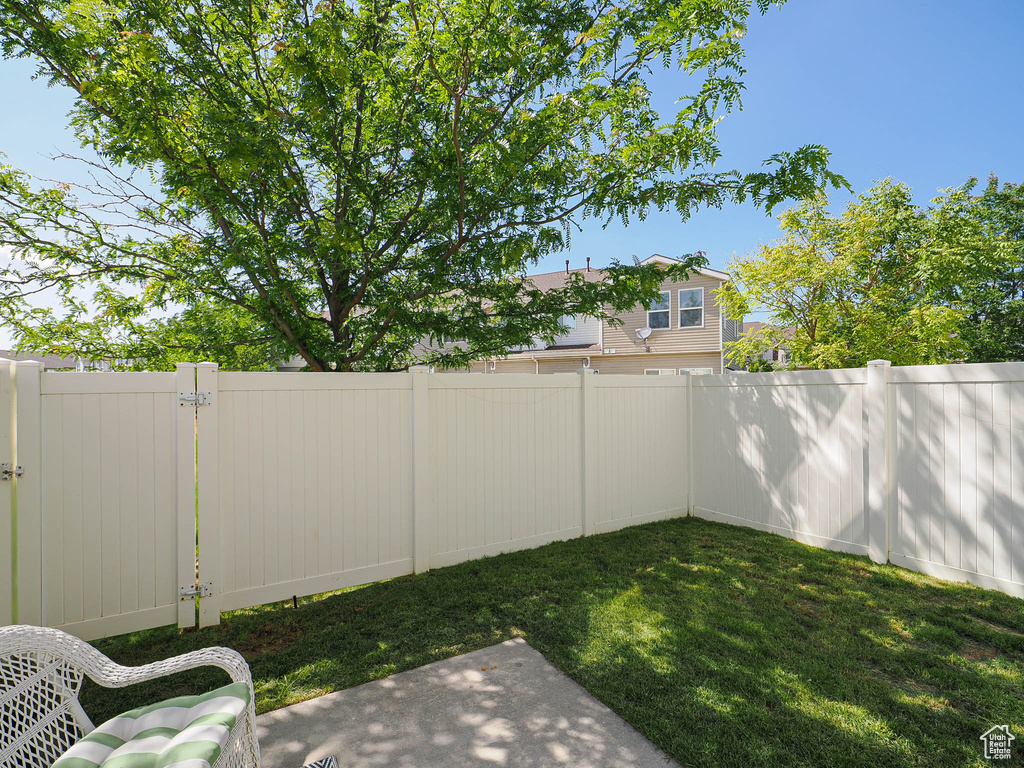 View of fenced backyard