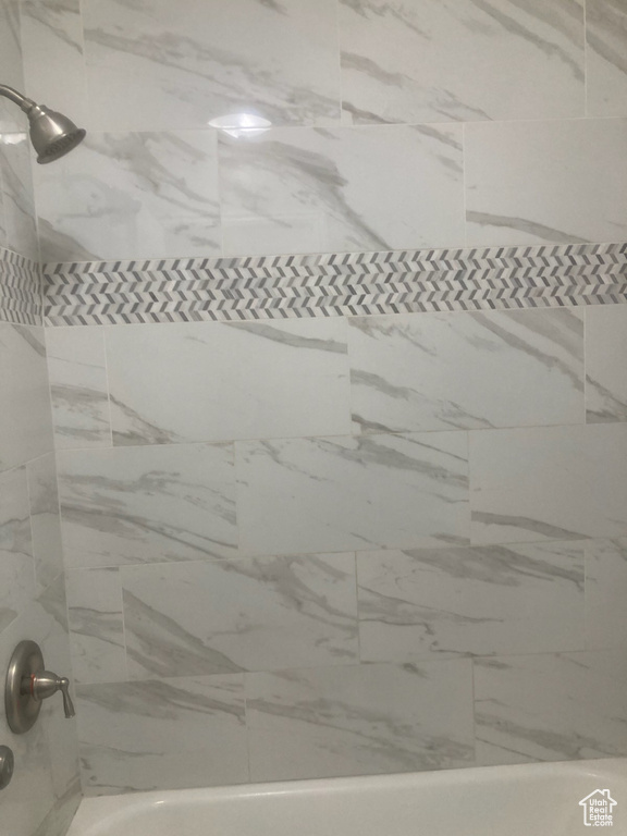 Bathroom featuring tub / shower combination