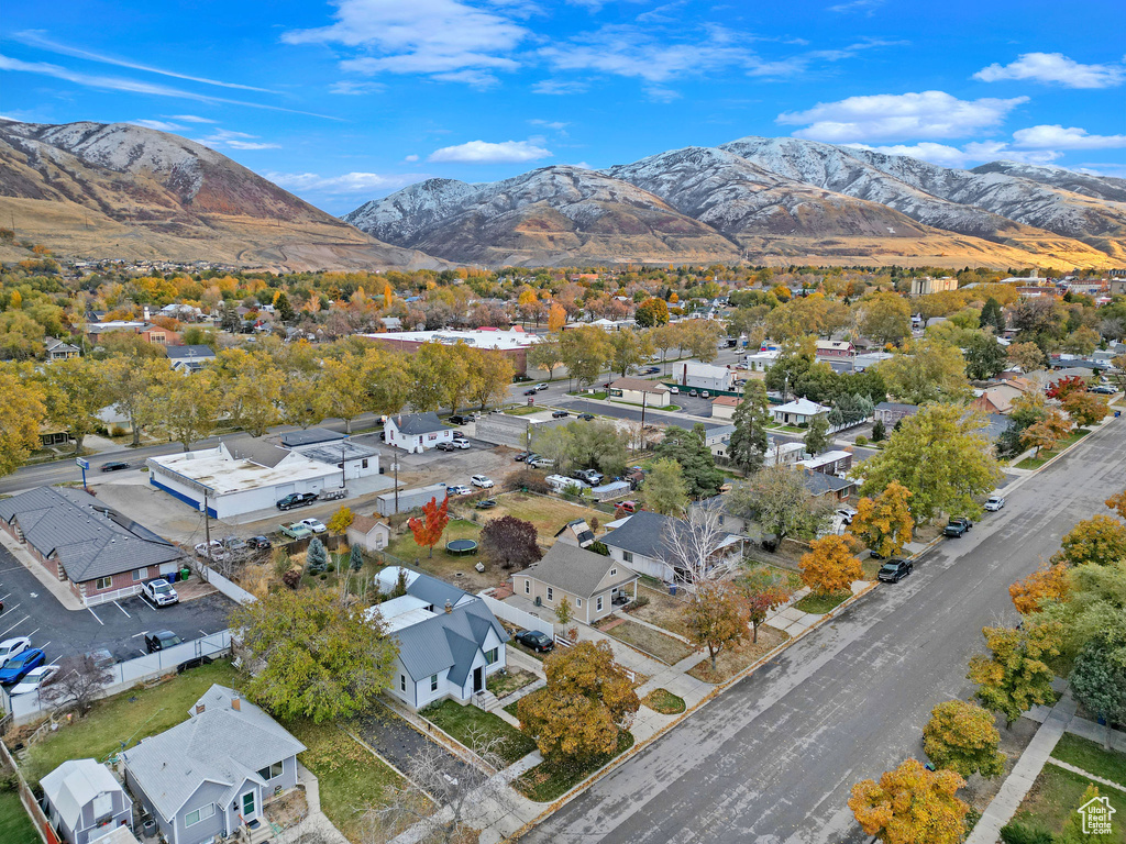 Aerial perspective of suburban area with a mountain backdrop