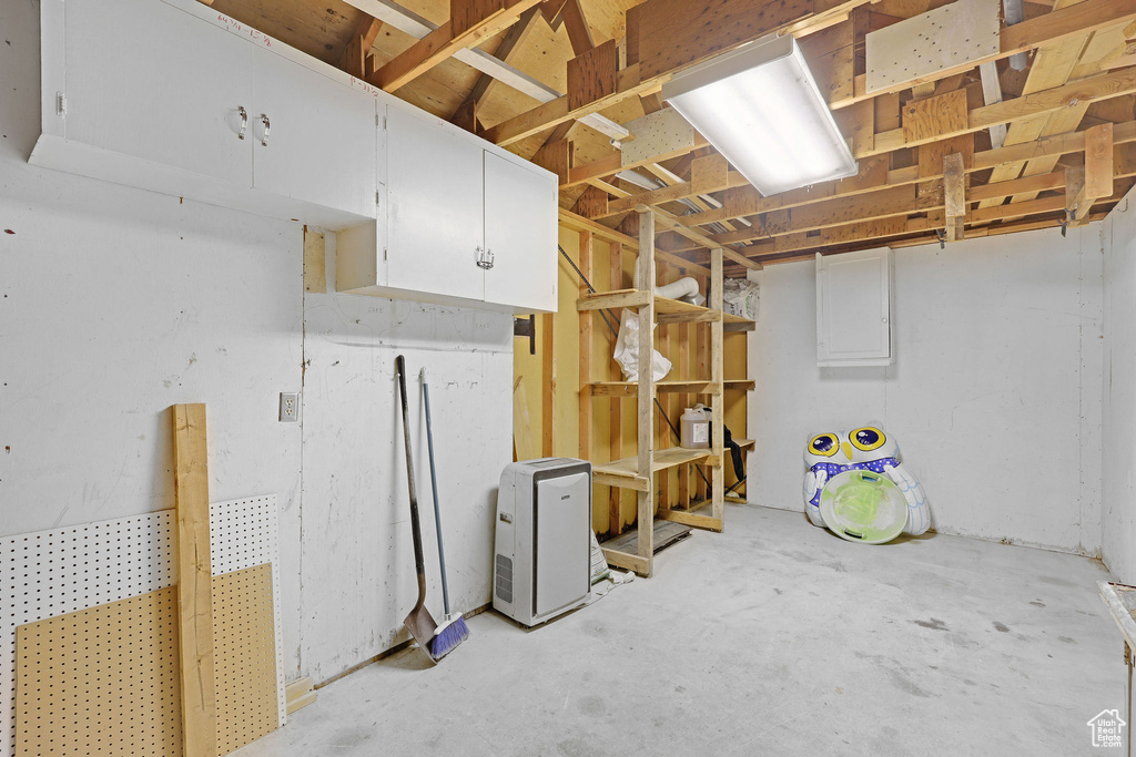 Unfinished below grade area with electric panel