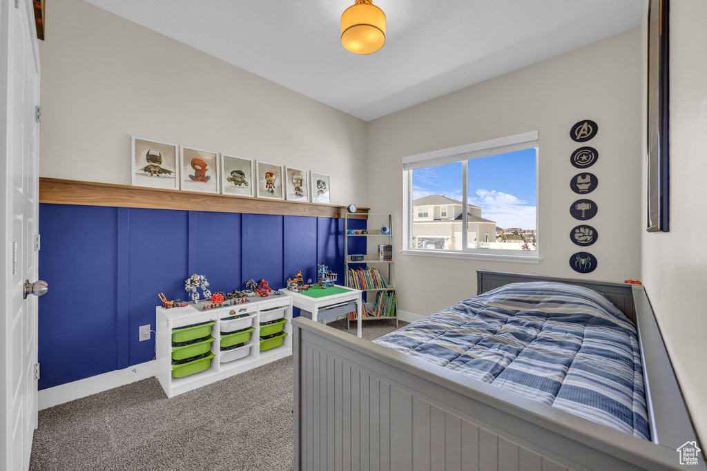 Bedroom with carpet flooring and baseboards