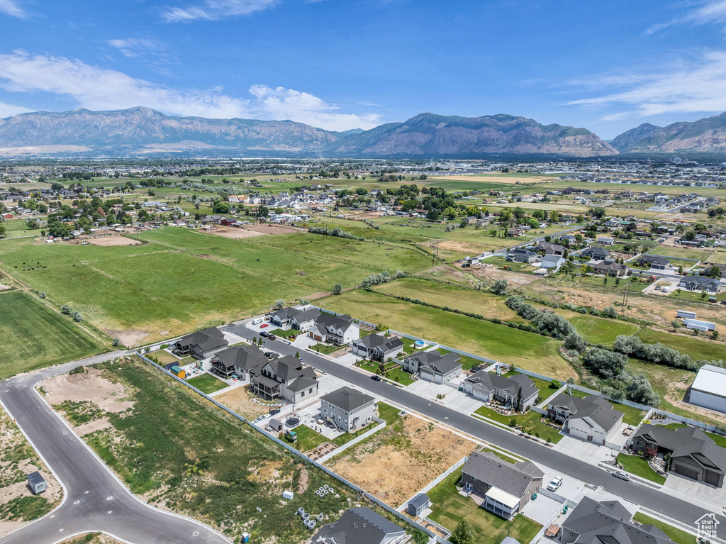 Aerial view of residential area featuring a mountainous background