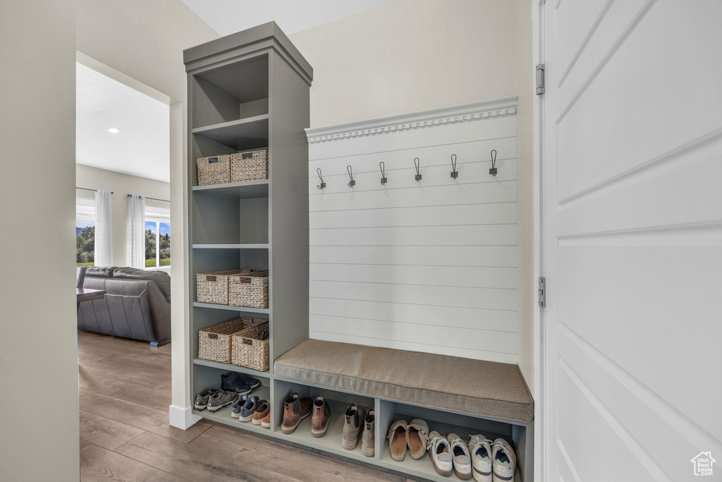 Mudroom featuring wood finished floors and recessed lighting