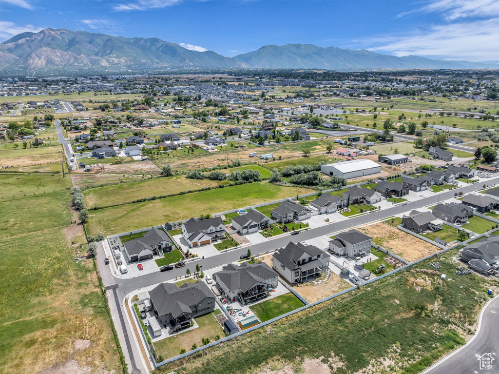 Aerial perspective of suburban area featuring a mountain backdrop