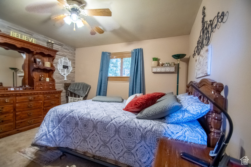 Bedroom featuring carpet and ceiling fan