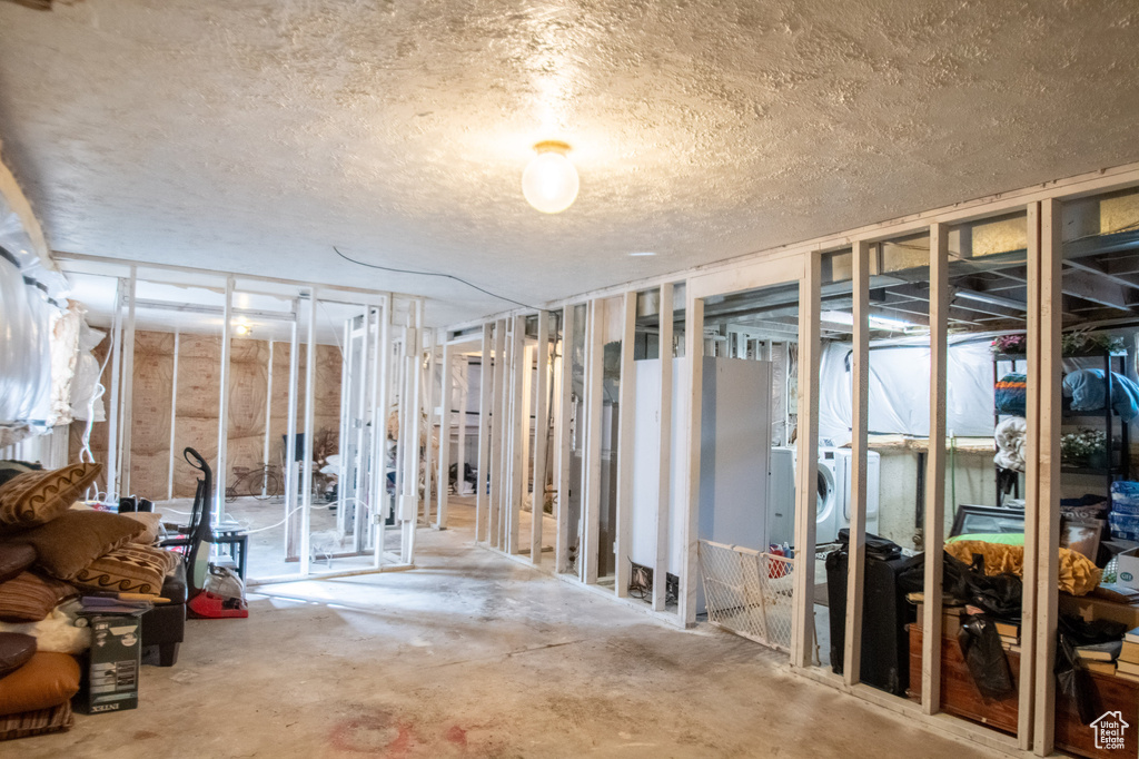 Basement featuring a textured ceiling
