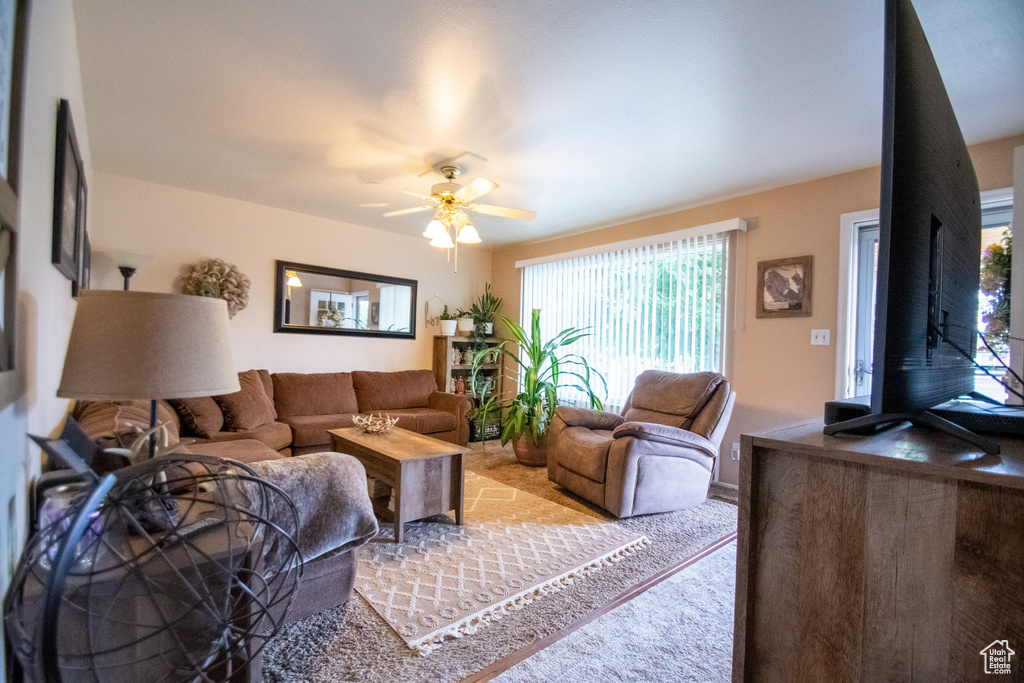 Living room featuring a ceiling fan