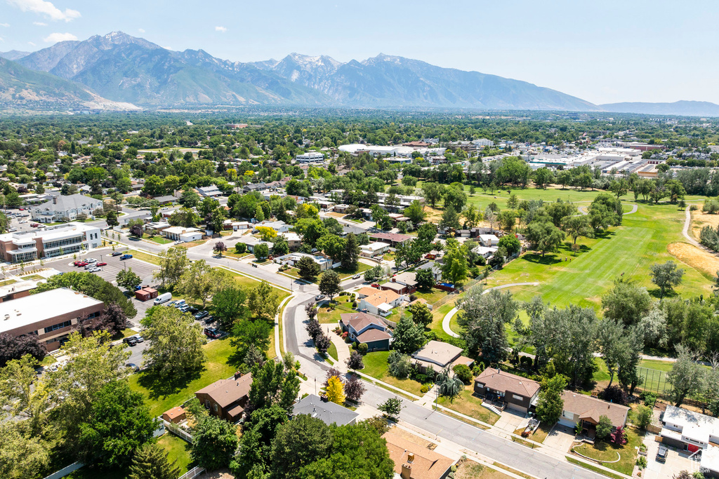 Aerial view of residential area featuring a mountain backdrop
