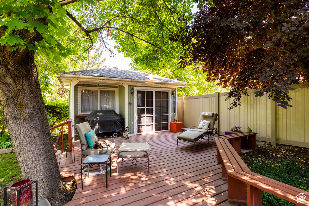 Deck with area for grilling and an outdoor structure