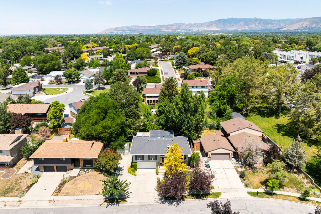Aerial perspective of suburban area with a mountainous background