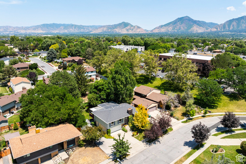 Aerial view of residential area featuring a mountain backdrop