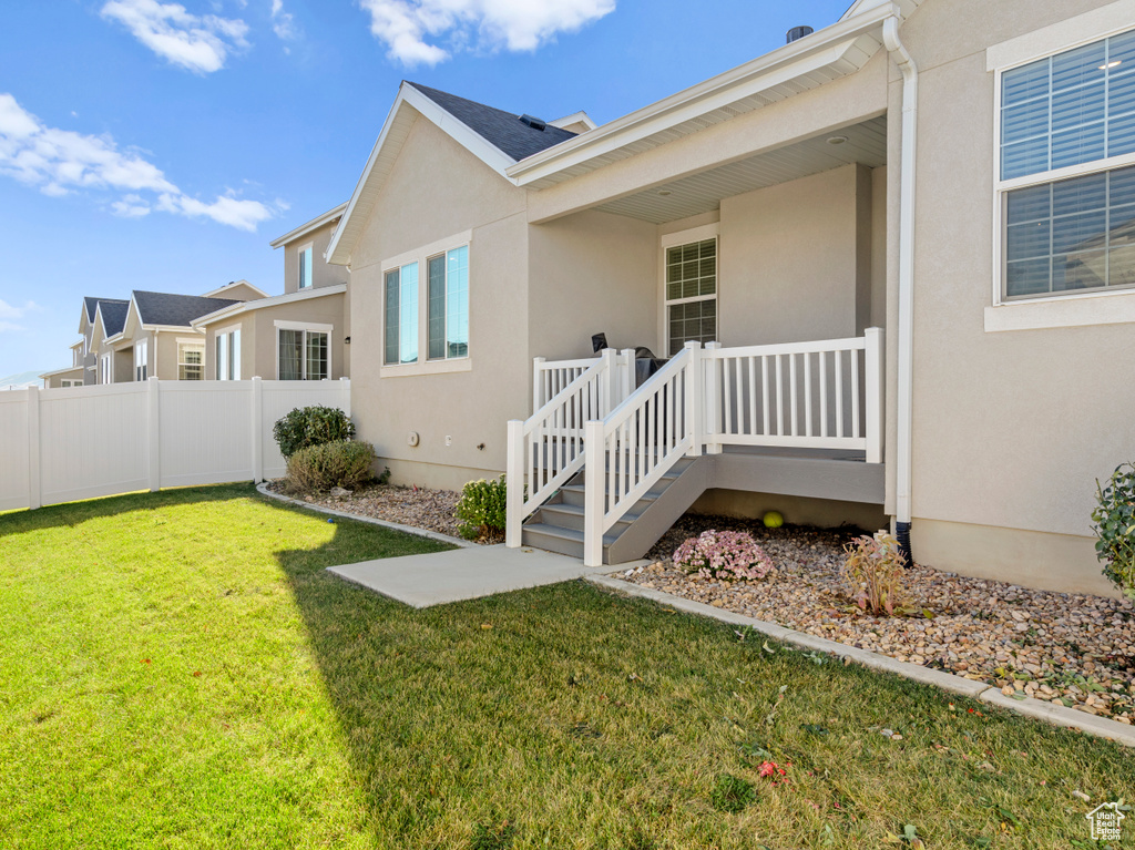 View of side of property featuring stucco siding