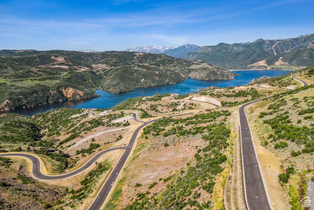 Aerial overview of property's location featuring a water and mountain view