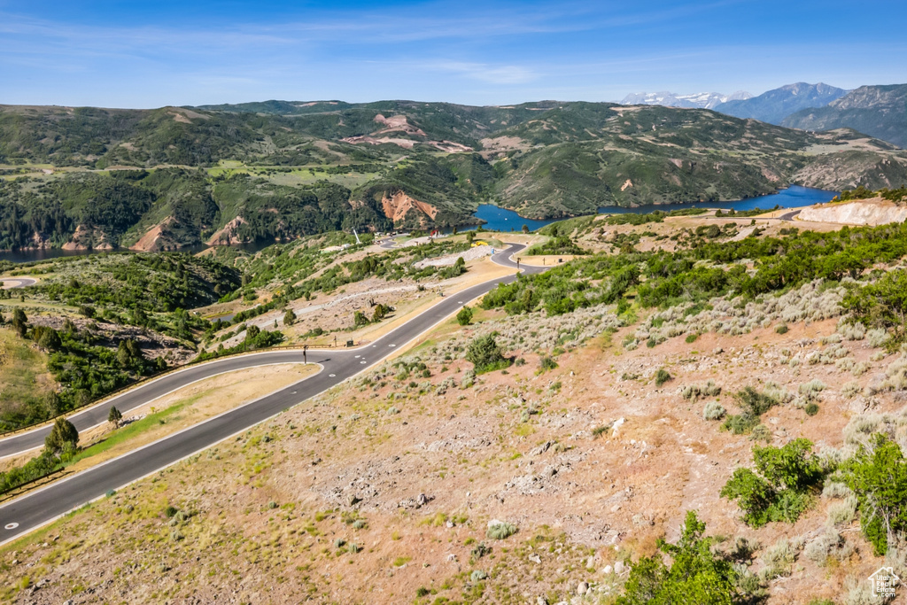 Mountain view featuring a nearby body of water