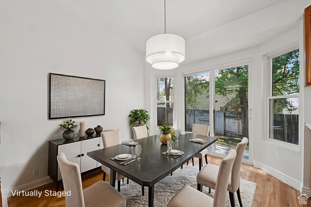 Dining area featuring baseboards and light wood-style floors