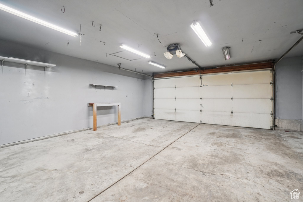 Garage featuring a garage door opener