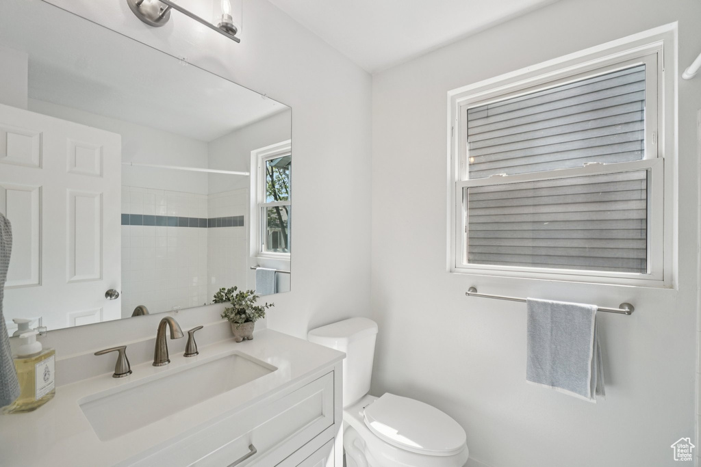 Full bath with vanity and a shower