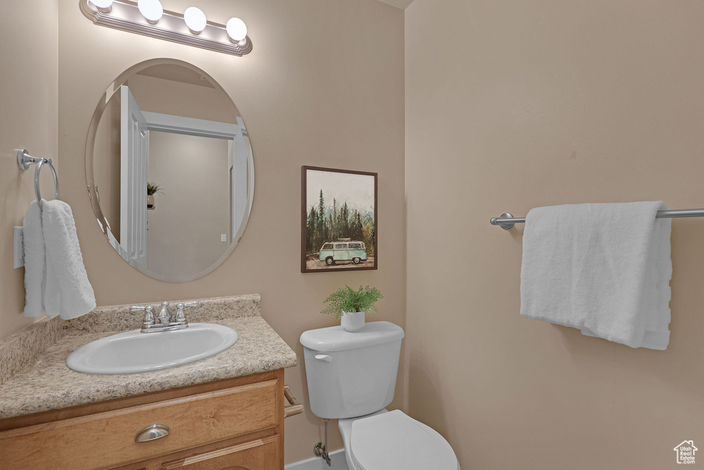 Bathroom with toilet and vanity