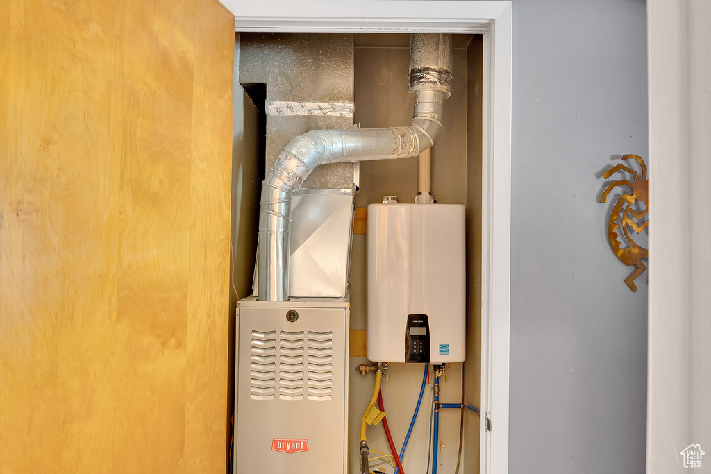 Utility room featuring water heater