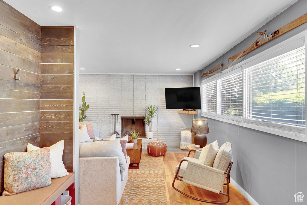 Living room featuring plenty of natural light, recessed lighting, and wood finished floors