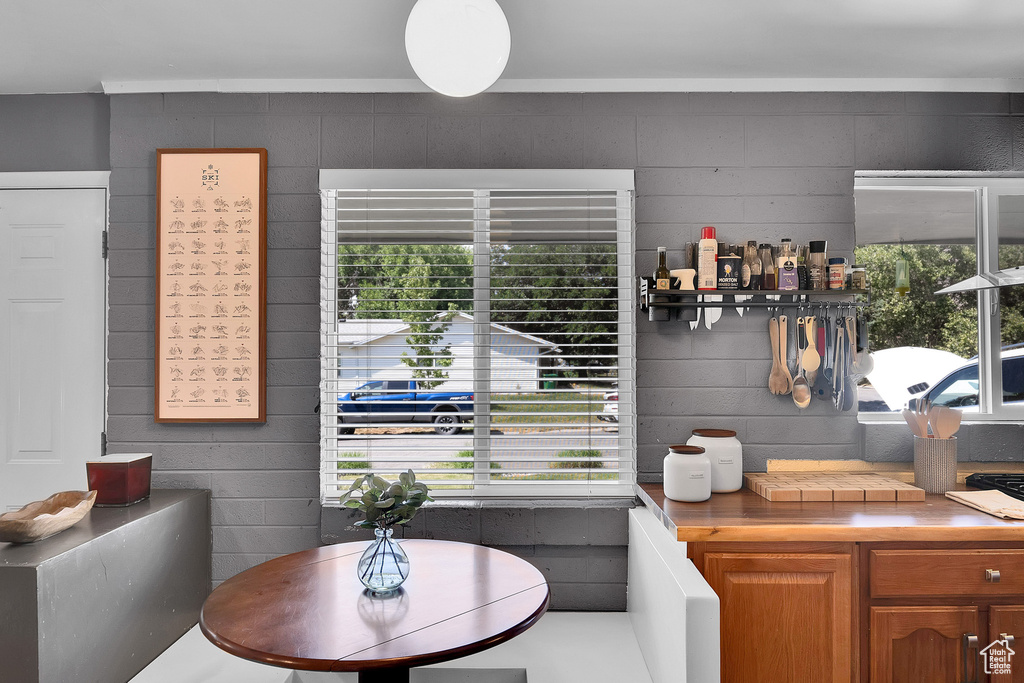 Dining room with concrete block wall