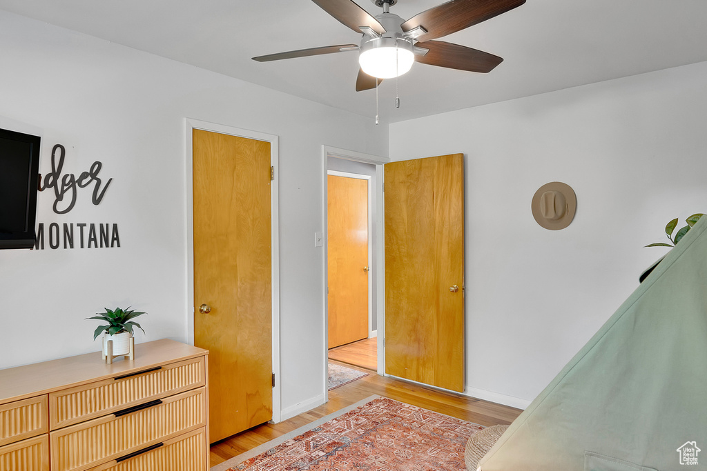 Bedroom with light wood-style flooring and ceiling fan