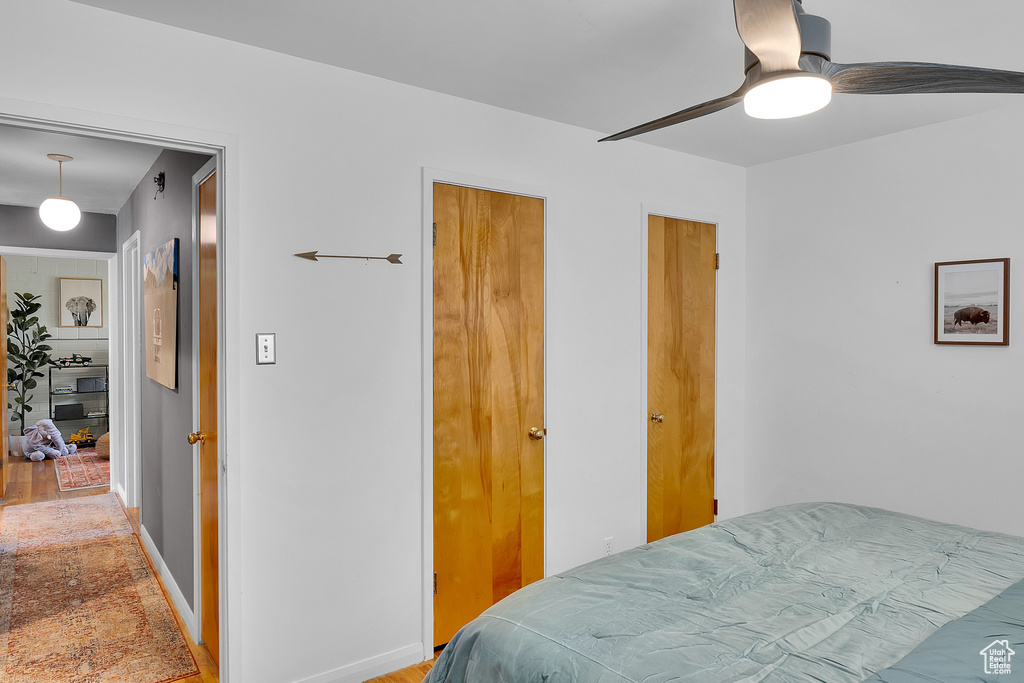 Bedroom featuring baseboards and ceiling fan
