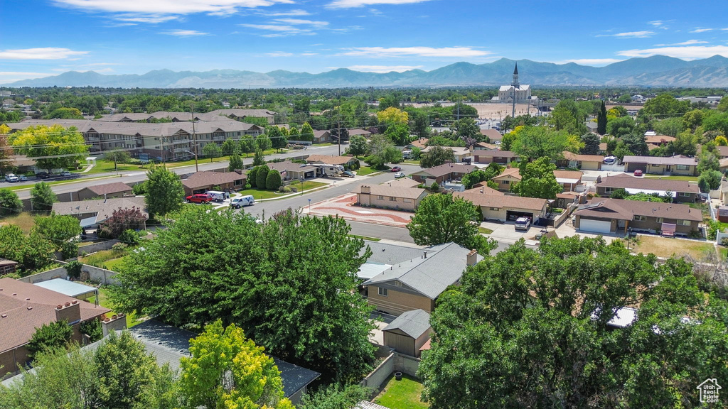 Aerial view of residential area featuring a mountain backdrop