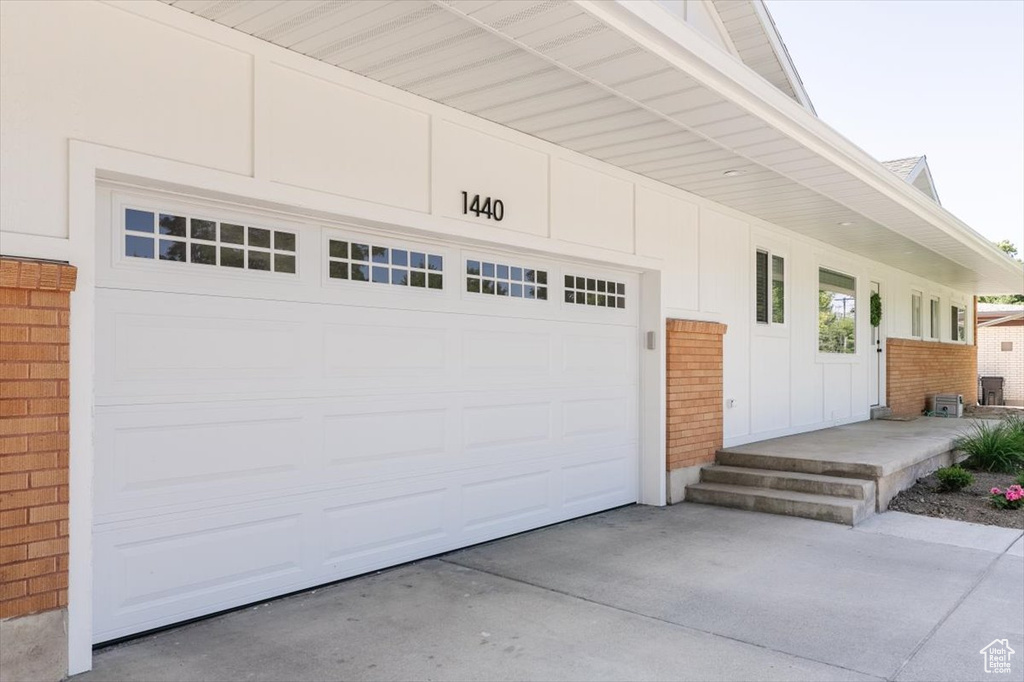 Garage featuring driveway