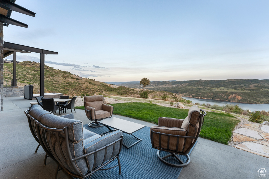 View of patio / terrace featuring a water view, an outdoor hangout area, and outdoor dining space