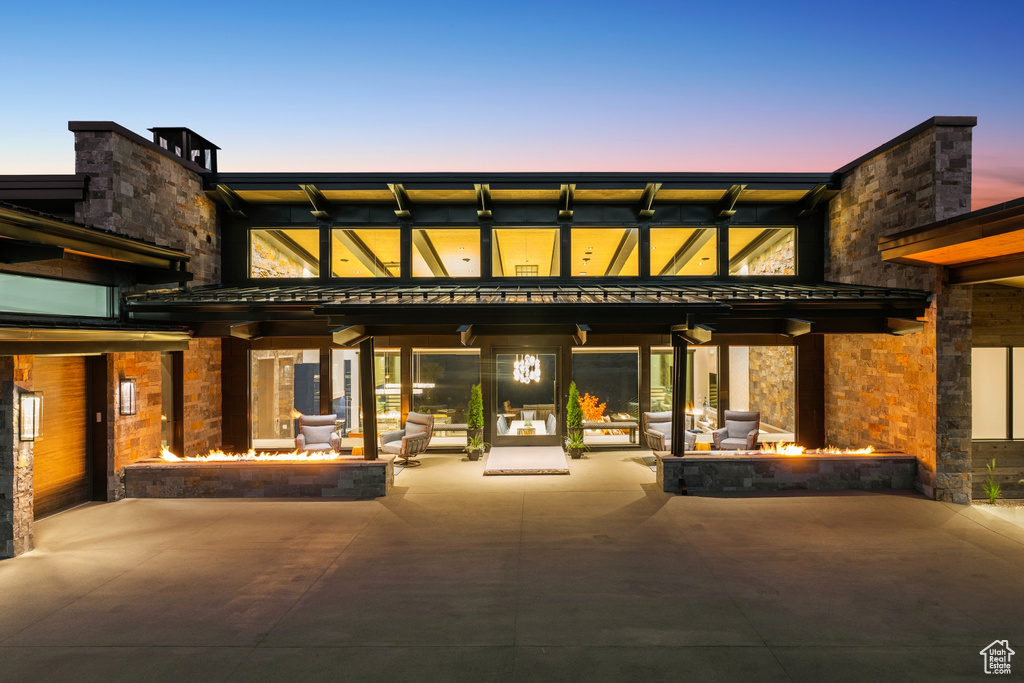 View of property with an outdoor fire pit