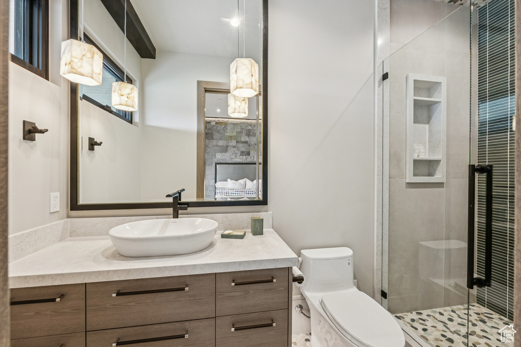 Full bath featuring vanity and a stall shower
