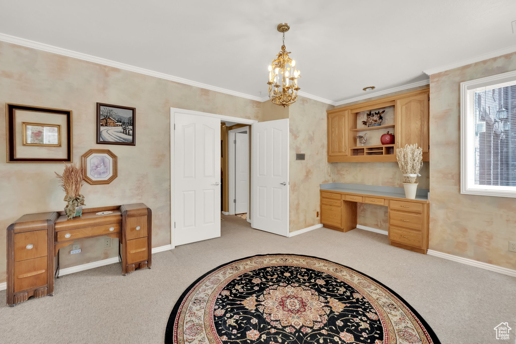 Office area featuring light carpet, a chandelier, and ornamental molding