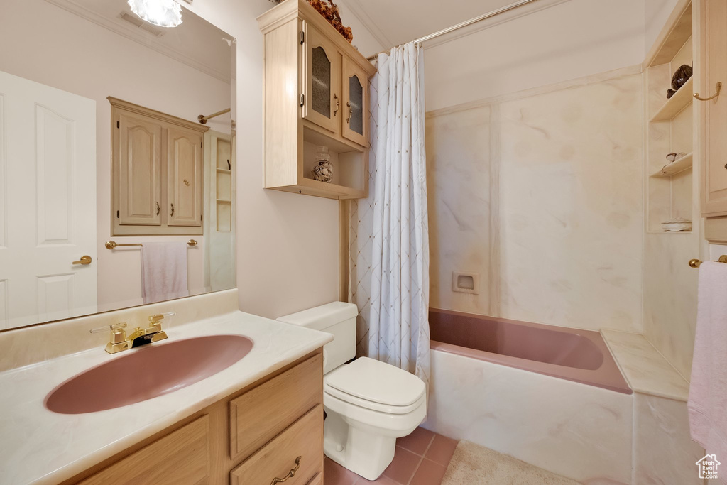 Bathroom with vanity, shower / bathtub combination with curtain, and tile patterned floors