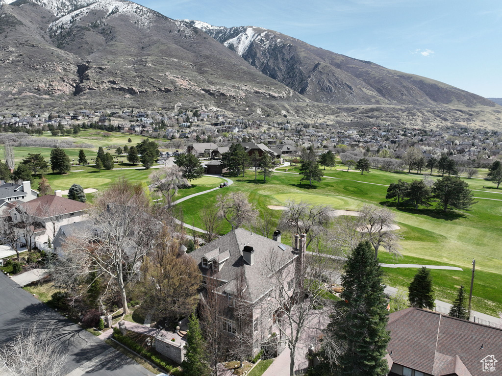 View of mountain background with a golf club and nearby suburban area