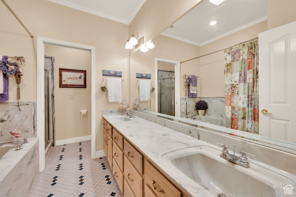Full bath featuring tile patterned flooring, a bath, a shower stall, double vanity, and crown molding
