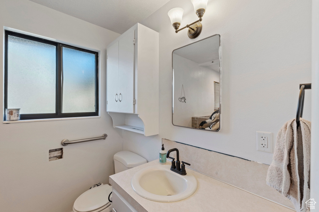 Bathroom with toilet and vanity
