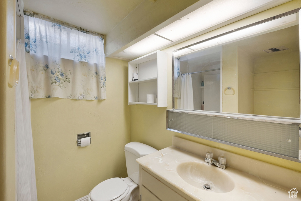 Full bath featuring vanity and a shower with shower curtain