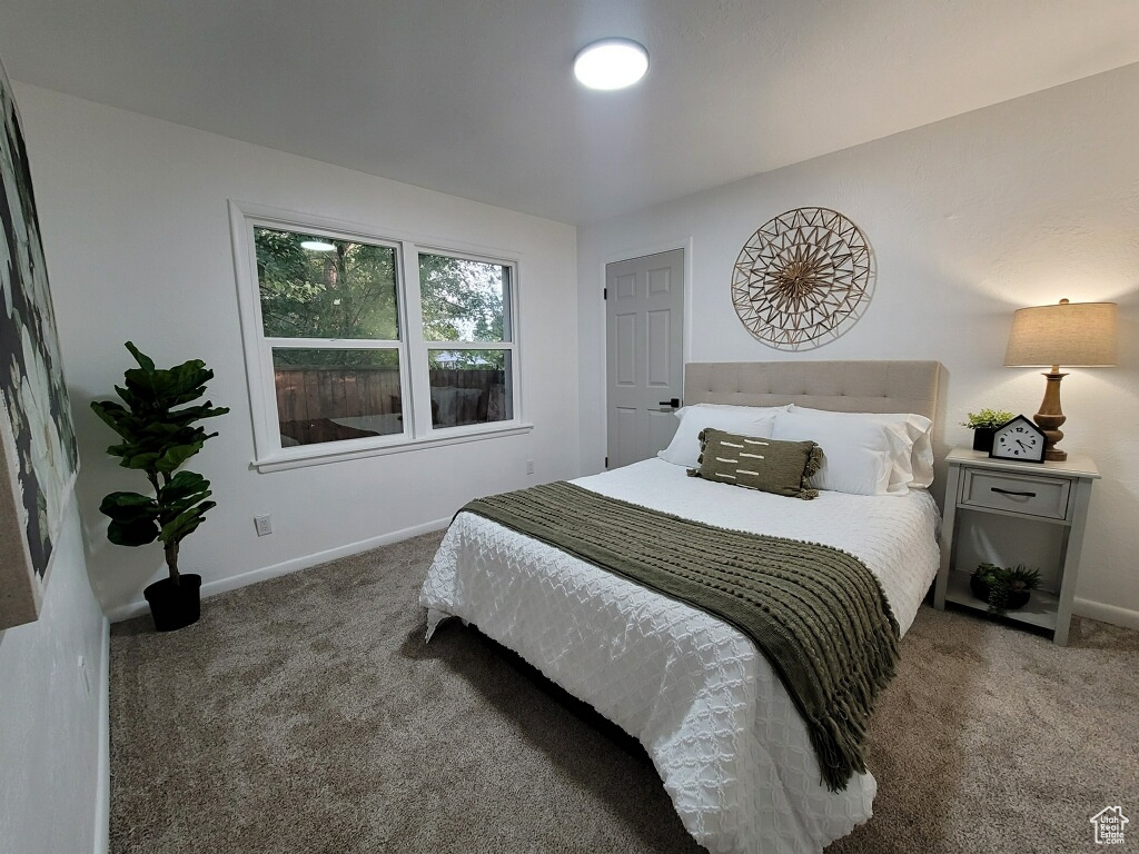Carpeted bedroom with baseboards