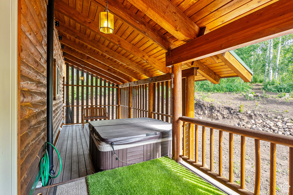 Wooden terrace with a hot tub